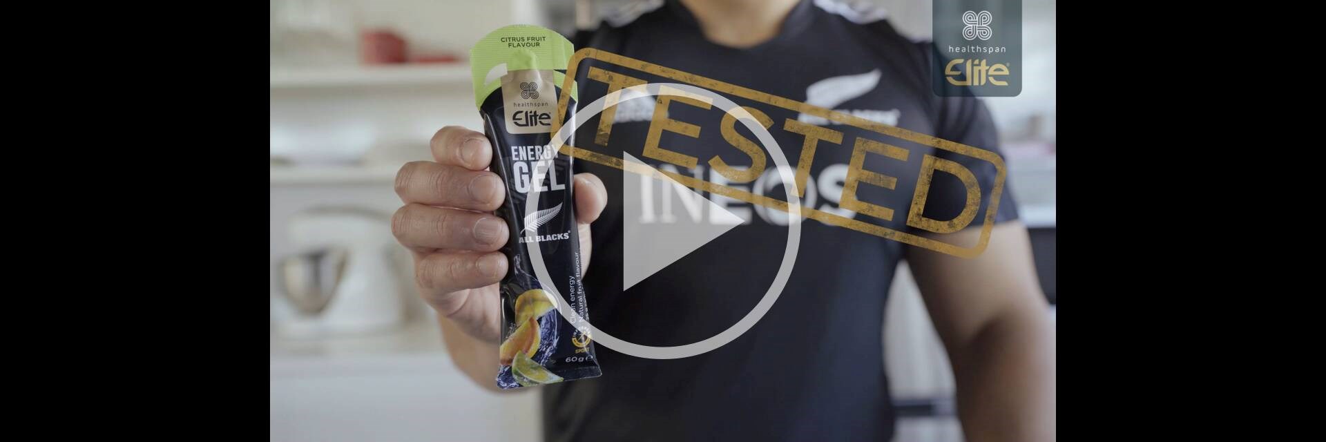 All Blacks player holding Elite All Blacks Energy Gel sachet