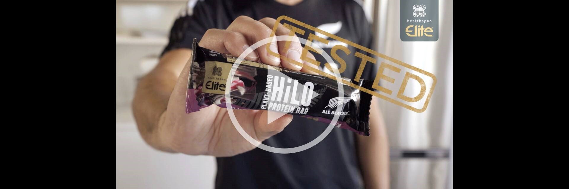All Blacks player holding Elite All Blacks HiLo bar