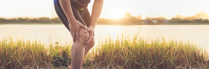 Man holding knee