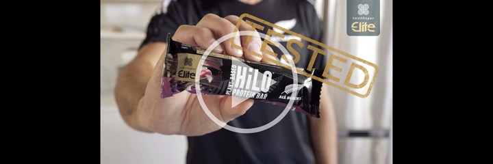 All Blacks player holding Elite All Blacks HiLo bar