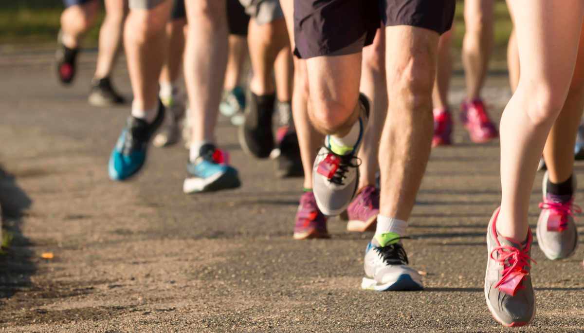 Image of multiple runners legs