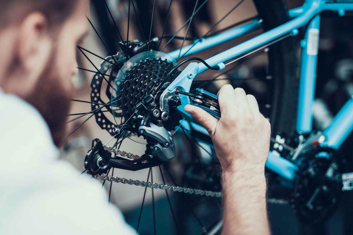 Man fixing bicycle wheel