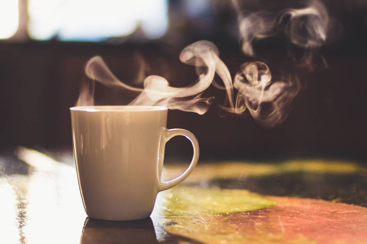 Hot drink in white mug on table