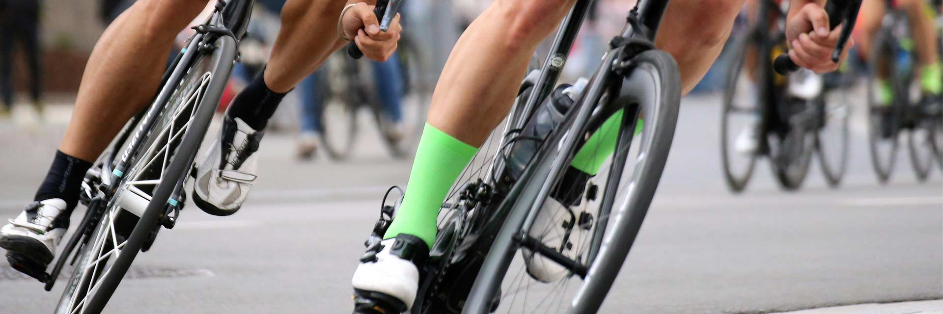 Photo of bicycle wheels with riders legs